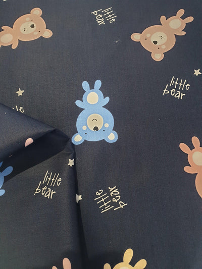 Cotton Baby Bear Fabric. Blue and Brown Bears with Small Gold Stars on Navy Background  