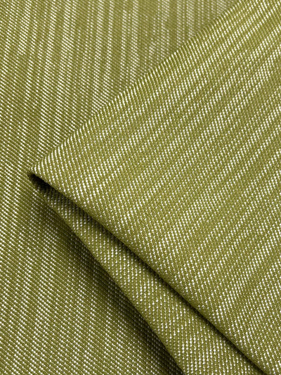 Close-up of a folded piece of Super Cheap Fabrics' Upholstery Twill - Sweet Pea - 147cm with a subtle striped pattern. The texture appears slightly rough, and the fabric is neatly creased. The durable fabric's stripes are uniformly spaced, creating a consistent design throughout.