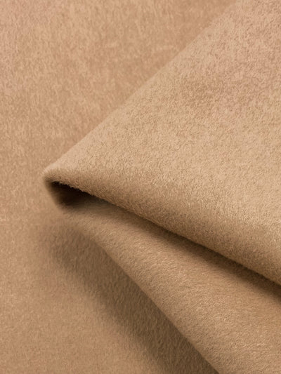 A wool cashmere fabric in a tapioca colour. Heavy weight fabric suitable for winter garments such as coats, outerwear & jackets