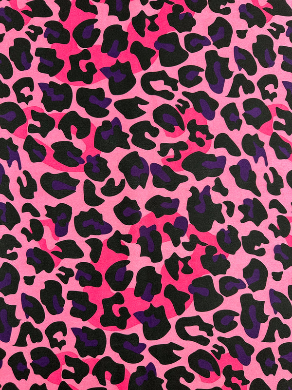 Introducing the Silky Satin - Pinky by Super Cheap Fabrics, a lightweight fabric featuring an elegant pink and black leopard print. Measuring 150cm wide, this exquisite satin exudes sophistication.