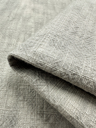 A close-up view of a folded piece of Moonstruck Basket Dyed Cotton from Super Cheap Fabrics, highlighting its detailed twill weave pattern and soft texture.