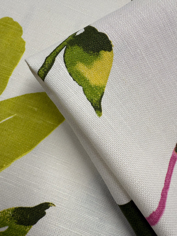 Close-up of Super Cheap Fabrics' Pure Linen - Spring Bloomscape - 150cm, showing its breathable texture and hand-painted look with green, yellow, and pink leafy patterns for a fresh spring feel.