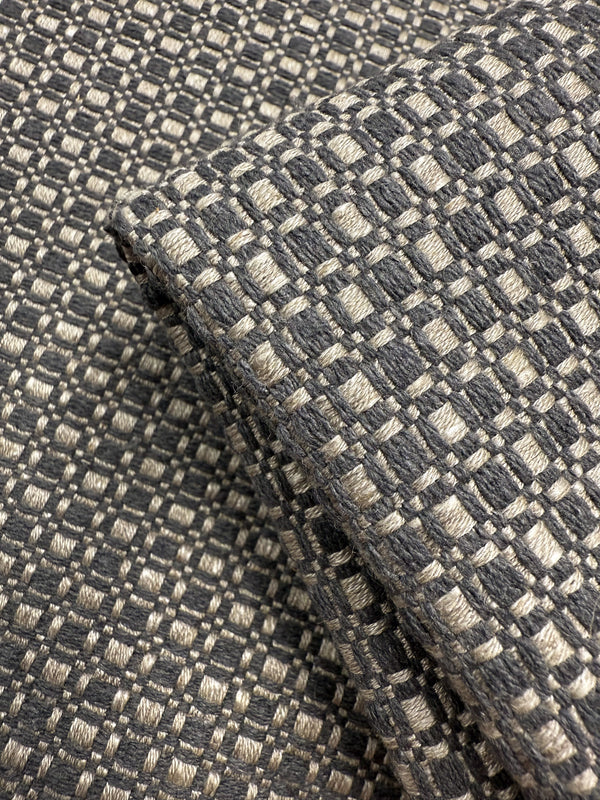 Close-up of Super Cheap Fabrics’ Upholstery Basketweave - Aria Steel (144cm): premium Australian fabric with a soft, thick feel and a textured checkerboard pattern in gray and beige featuring a raised, grid-like design.