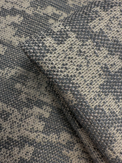 Close-up of Super Cheap Fabrics' Upholstery Jacquard - Westwood Grey Dusk (154cm), showing its gray and beige geometric pattern and intricate weave, ideal for premium upholstery projects.