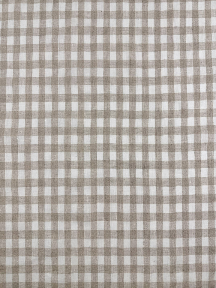 Pure Linen - Oatfield Check by Super Cheap Fabrics features a beige and white gingham grid on 100% pure linen. This 140cm wide lightweight fabric has a soft, subtly woven texture, ideal for stylish projects.