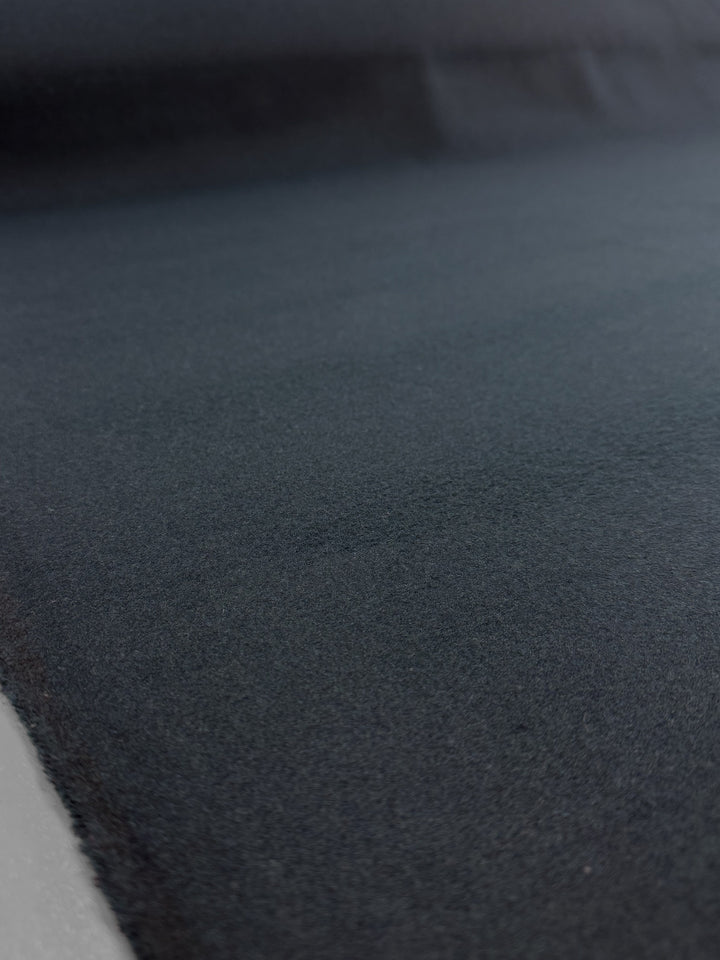 Close-up of the Wool Cashmere - Gulf Coast - 154cm by Super Cheap Fabrics, showcasing its smooth, dark gray surface and soft texture with subtle shading across this premium blend.