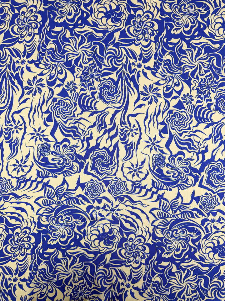 Mercerised Rayon - Cobalt Whirl by Super Cheap Fabrics features a dense blue and white floral swirl pattern, perfect for breathable or lightweight creations. Width: 150cm.