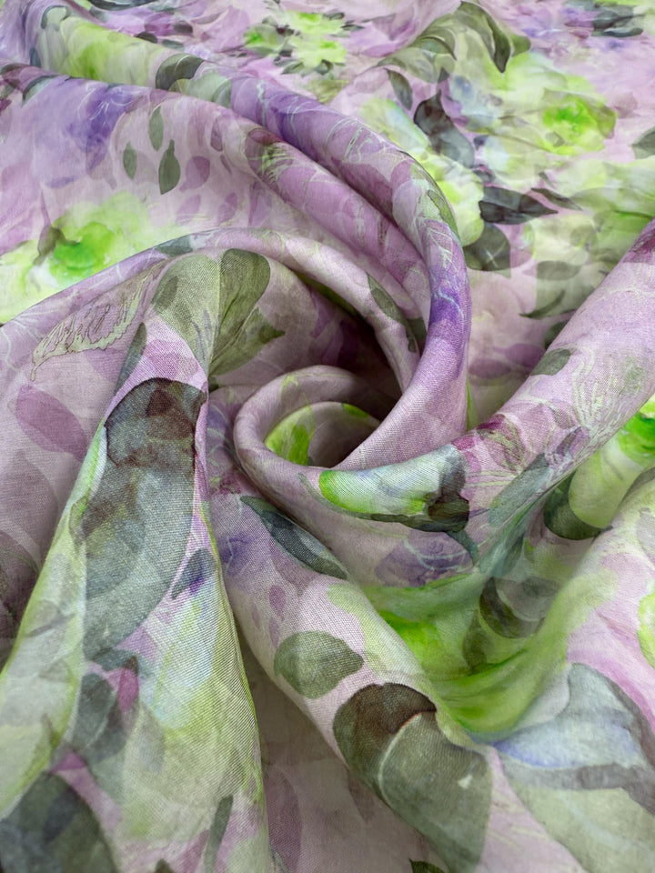 Designer Cotton - Lime Smoke by Super Cheap Fabrics is a soft, sheer, lightweight cotton fabric with a delicate floral pattern in purple, green, and gray swirls. Width: 145cm.