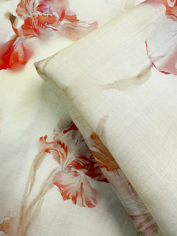Close-up of Designer Cotton - Painted Petal (145cm) by Super Cheap Fabrics, featuring lightweight cotton with a delicate watercolor floral print in coral, pink, and beige—ideal for luxury sewing projects.