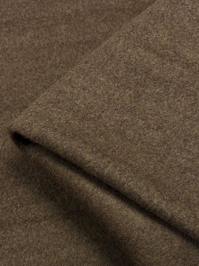 A wool cashmere fabric in a emperadorcolour. Heavy weight fabric suitable for winter garments such as coats, outerwear & jackets