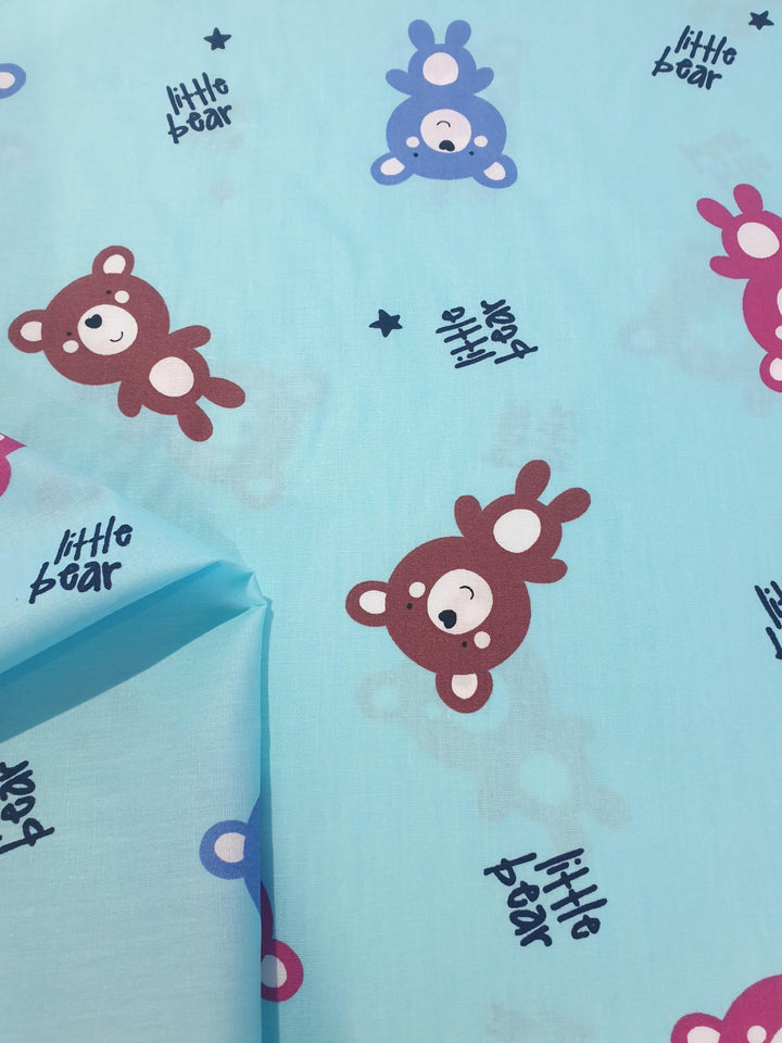 Cotton Baby Bear Fabric. Pink, Blue and Brown Bears with Small Navy Stars on Light Blue Background  